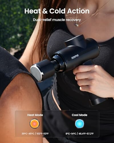 Person using a massage gun with heat and cold modes for muscle recovery.