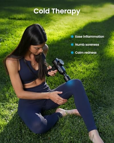 Woman using a cold therapy device on her leg outdoors